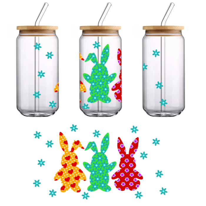 Colorful decorative bunnies in vibrant patterns stand together against a backdrop of cheerful, light-blue snowflakes.UV Transfersdtf regular iron