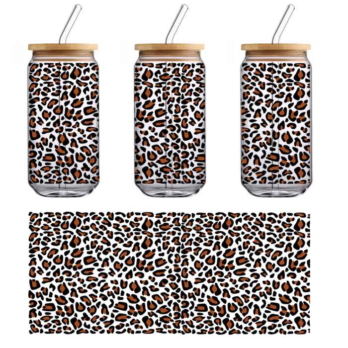 A vibrant black fabric featuring an abstract pattern of brown shapes, perfect for crafting or fashion projects.UV Transfersdtf regular iron