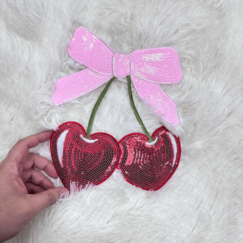 Red heart-shaped sequin patches with a pink bow.Patches