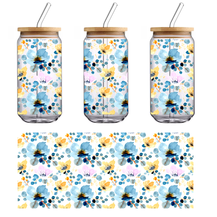 A beautiful floral pattern featuring blue, pink, and yellow blossoms on a black background.UV Transfers