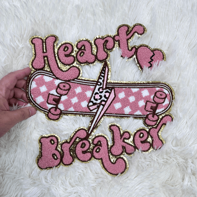 "Skateboard patch with 'Heart Breaker' text."Patches