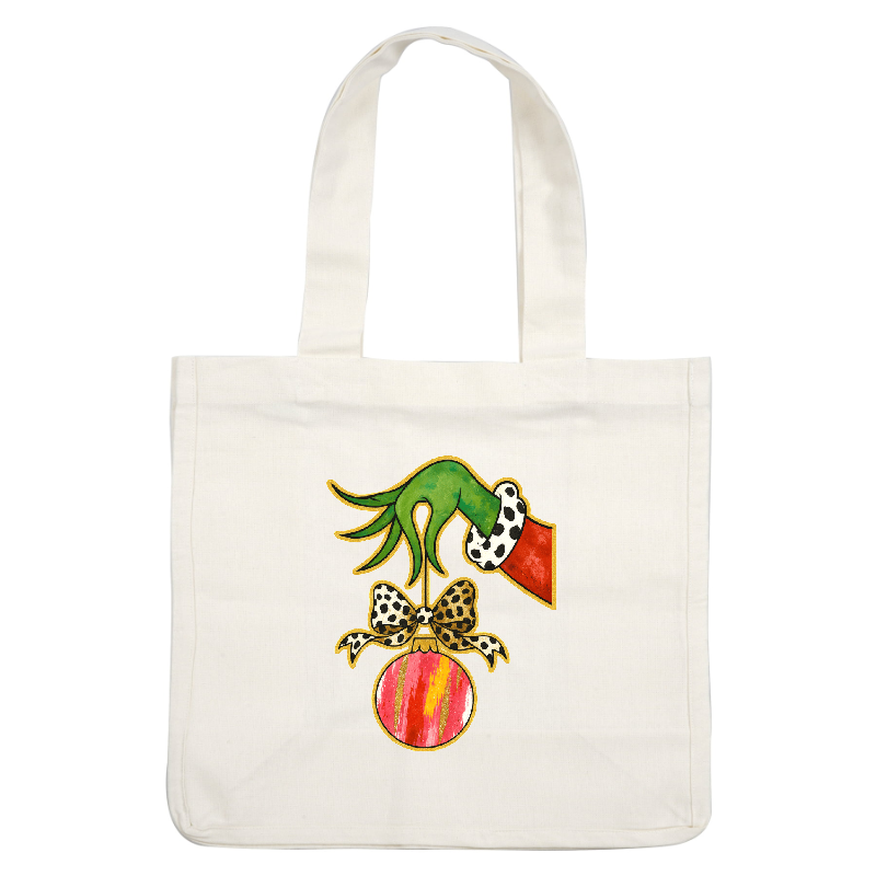 A whimsical green hand is hanging a colorful Christmas ornament with a bow.DTF Transfers