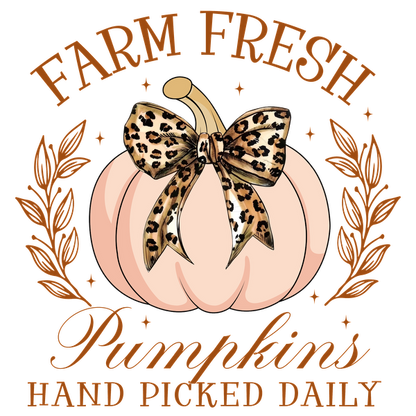 A stylish graphic featuring a soft pink pumpkin adorned with a leopard-print bow, emphasizing fresh, handpicked pumpkins.dtf regular iron