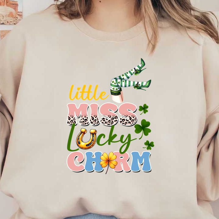 Whimsical "Little Miss Lucky Charm" design featuring playful text, leopard patterns, shamrocks, and a mischievous leprechaun's green-striped legs.