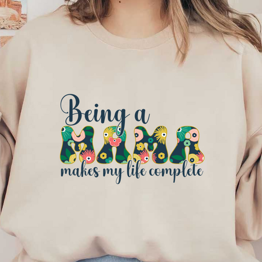 A colorful and cheerful design featuring the phrase "Being a Mama makes my life complete," perfect for proud mothers. dtf transfers