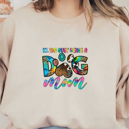 A colorful and whimsical graphic with the words "Kinda busy being a dog mom."DTF Transfers
