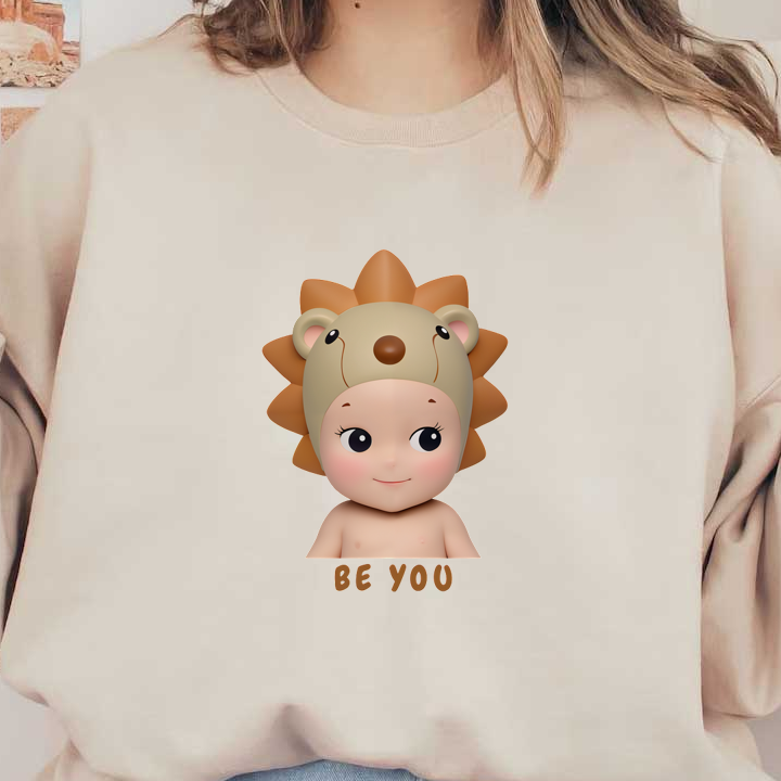 A playful illustration of a child wearing a cute lion-themed hat, encouraging the message "Be You" for self-expression.DTF Transfers dtf transfers