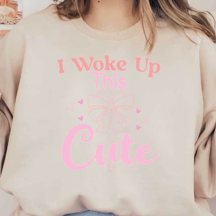 A playful graphic featuring the phrase "I Woke Up This Cute," accentuated by a charming bow and whimsical hearts.DTF Transfers