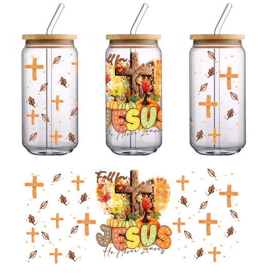 A vibrant autumn-themed illustration featuring pumpkins, colorful leaves, and a wooden cross, with the word "Jesus" in bold letters.UV Transfers dtf prints