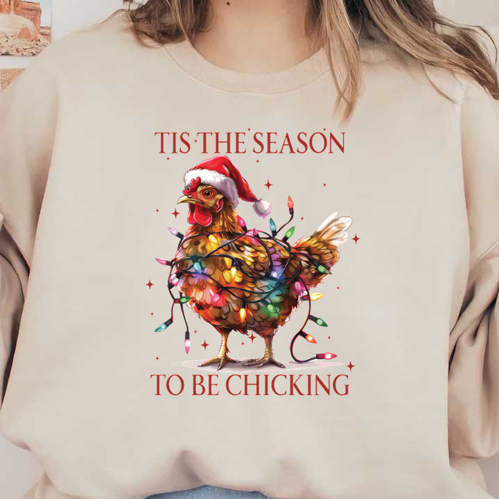 A festive chicken wearing a Santa hat is wrapped in colorful Christmas lights with the playful phrase "Tis the Season to be Chicking." dtf transfers