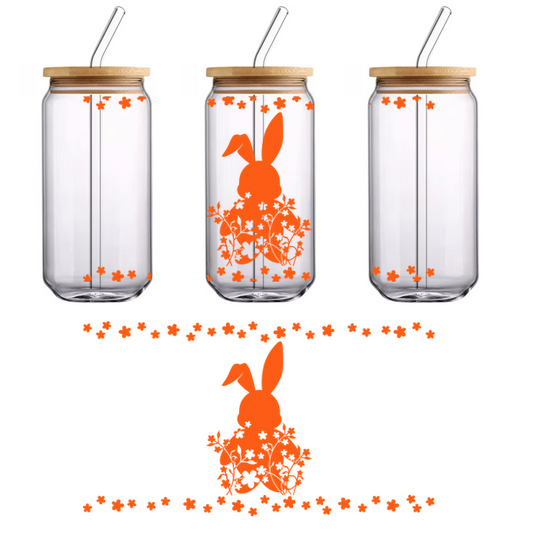 A vibrant orange bunny silhouette surrounded by floral patterns, perfect for spring or Easter-themed decorations.UV Transfers heat press transfers