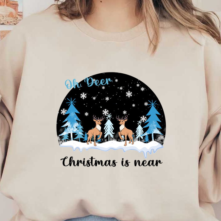 A whimsical winter scene featuring two deer among snowflakes and evergreens, with the playful caption "Oh Deer."dtf regular iron