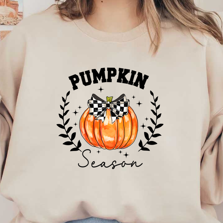 A vibrant orange pumpkin adorned with a stylish black and white checkered bow, perfect for autumn decorations. heat press transfers