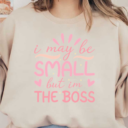Playful pink typography design stating "I may be small but I'm the boss," featuring fun elements like stars and hearts.DTF Transfers