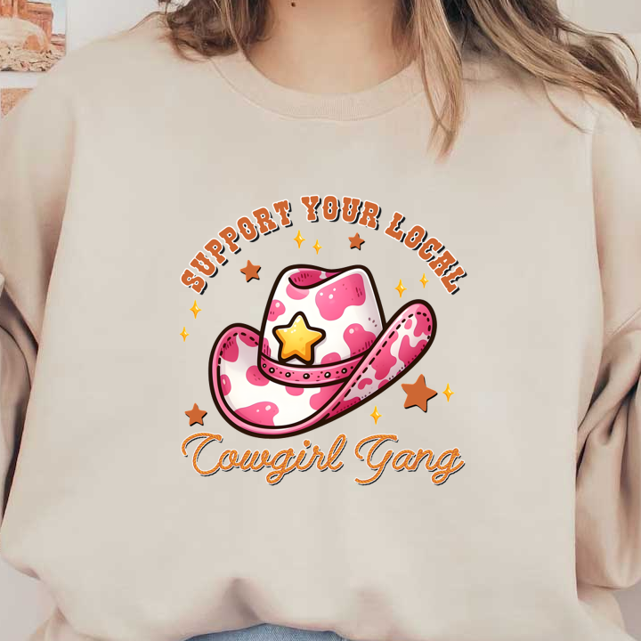 This charming graphic features a pink spotted cowboy hat with a star, surrounded by playful text supporting a local cowgirl gang.