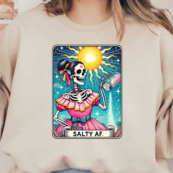 A vibrant illustration of a skeleton in a pink dress with a sun backdrop, playfully pouring salt, expressing a "Salty AF" vibe. heat press transfers