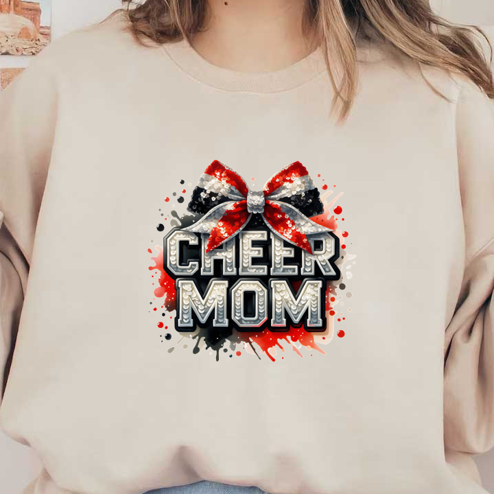 Gráfico festivo y brillante "Cheer Mom" ​​con un lazo brillante y letras llamativas, ¡perfecto para las orgullosas mamás animadoras! Transferencias DTF