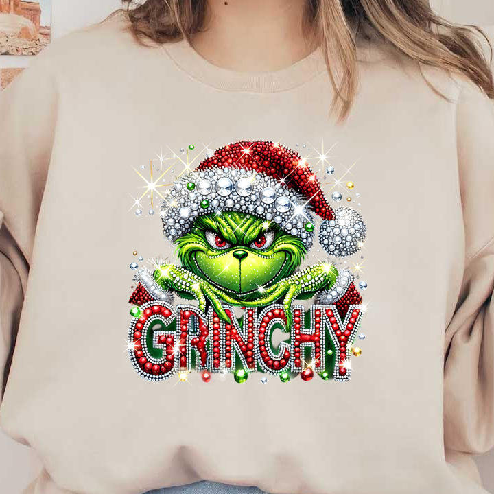 A sparkling, festive illustration of the Grinch features vibrant colors, holiday attire, and bold "GRINCHY" lettering adorned with jewels.DTF Transfers heat press transfers