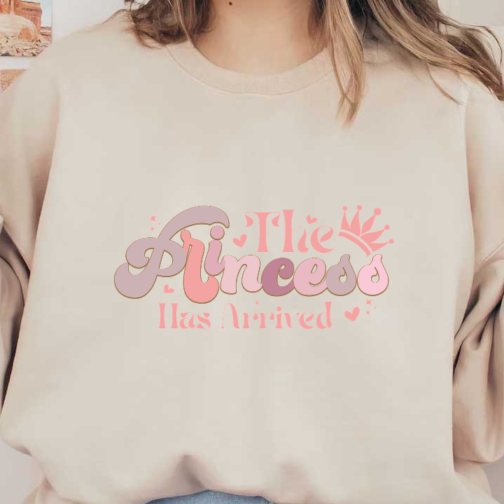 Celebrate with this charming "The Princess Has Arrived" design, featuring playful lettering and a cute crown, perfect for special occasions!DTF Transfers