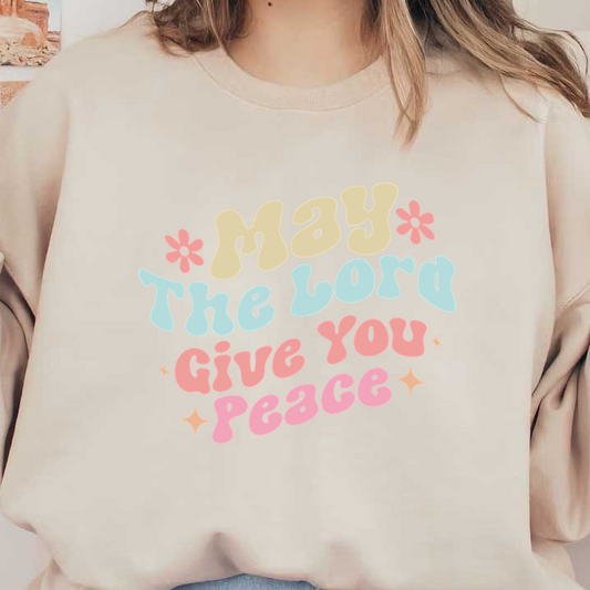 A colorful and playful typography design featuring the uplifting message, "May the Lord Give You Peace."dtf regular iron