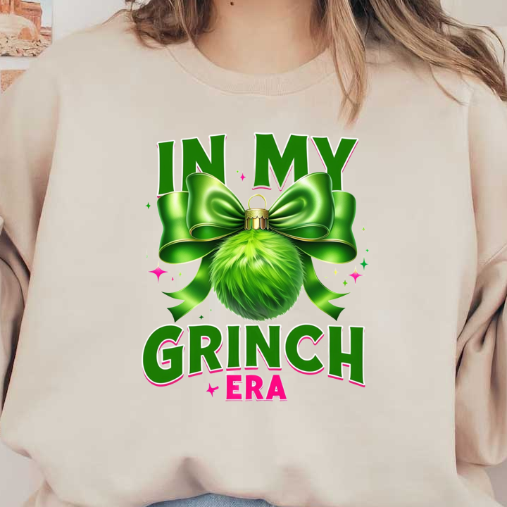 Celebrate the festive spirit with this vibrant "In My Grinch Era" graphic, featuring a fluffy green ornament and a stylish bow!DTF Transfers