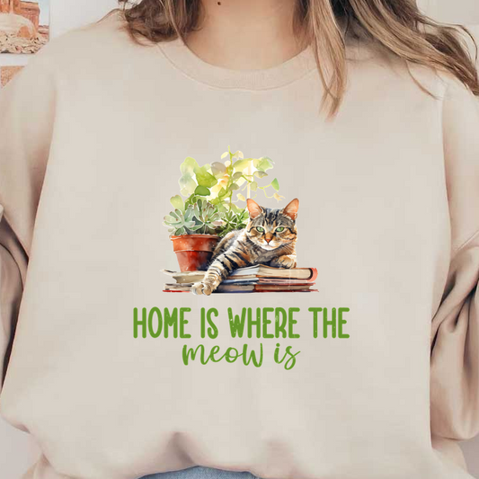 A charming illustration of a striped cat resting on books with a plant, showcasing the phrase "Home is where the meow is."dtf regular iron