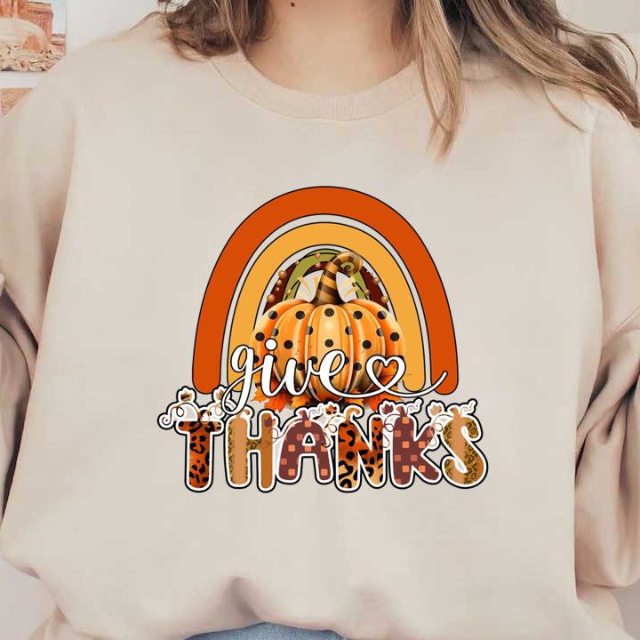 Un alegre diseño con temática otoñal que presenta un arcoíris vibrante y una calabaza con lunares con la frase "da gracias".