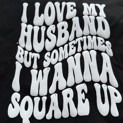 This humorous black t-shirt features bold, white, wavy text expressing a playful sentiment about love and frustration in relationships.DTF Transfers puff