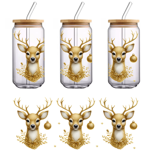 Three charming golden deer heads adorned with antlers and festive ornaments, surrounded by leafy decorations, perfect for holiday decor.UV Transfers