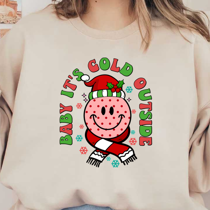 A cheerful holiday design featuring a smiling snowman in a Santa hat with the phrase "Baby It's Cold Outside." dtf prints