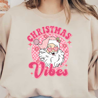 Colorful and cheerful illustration of a playful Santa with heart-shaped glasses, surrounded by "Christmas Vibes" text in pink.dtf regular iron