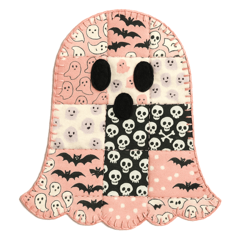 Adorable ghost-shaped quilt featuring a playful patchwork of spooky patterns.DTF Transfers