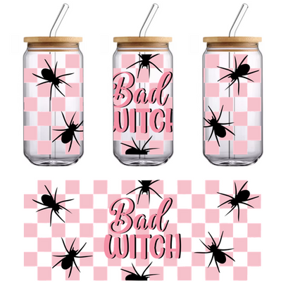 A playful design featuring the phrase "Bad Witch" in pink on a pink and black checkered background with spider graphics.UV Transfers heat press transfers