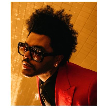 A stylish individual sports a bold red suit and oversized sunglasses, exuding confidence against a shimmering golden backdrop.DTF Transfers dtf prints