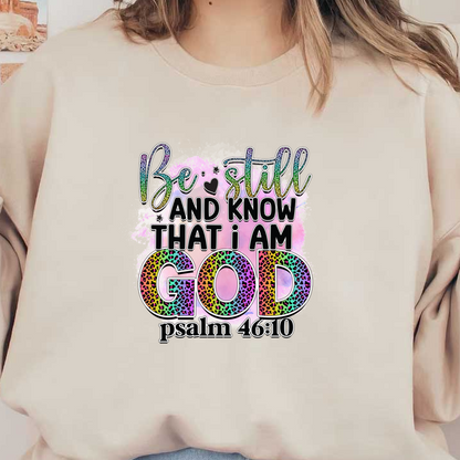 A vibrant design featuring the inspirational quote "Be still and know that I am God" from Psalm 46:10, enhanced with colorful, leopard-print letters.DTF Transfers