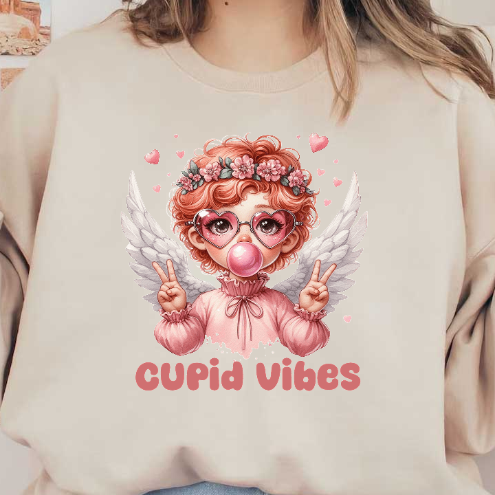 A whimsical angel with pink hair and wings holds up peace signs, surrounded by hearts, with a "Cupid Vibes" caption.DTF Transfers