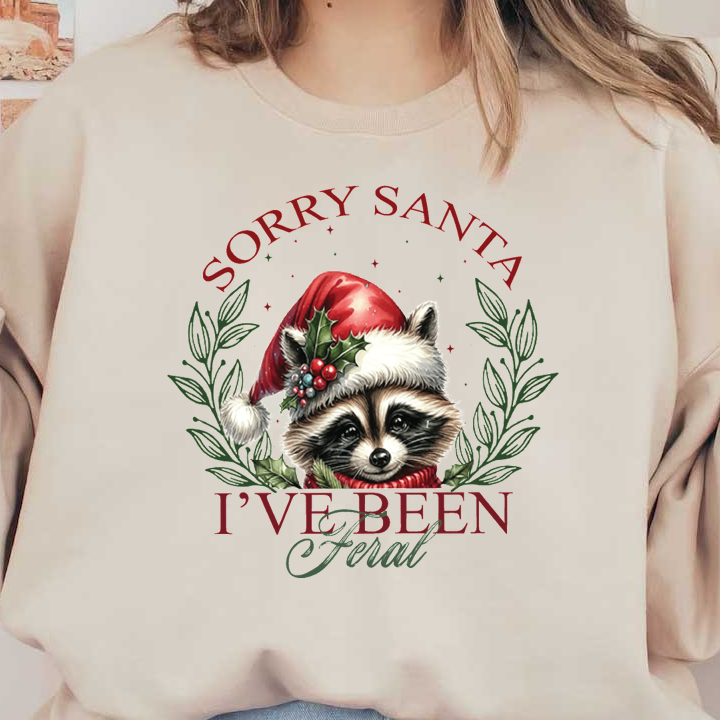 This festive design features a raccoon in a Santa hat, surrounded by holly, with the playful text, "Sorry Santa, I've Been Feral."