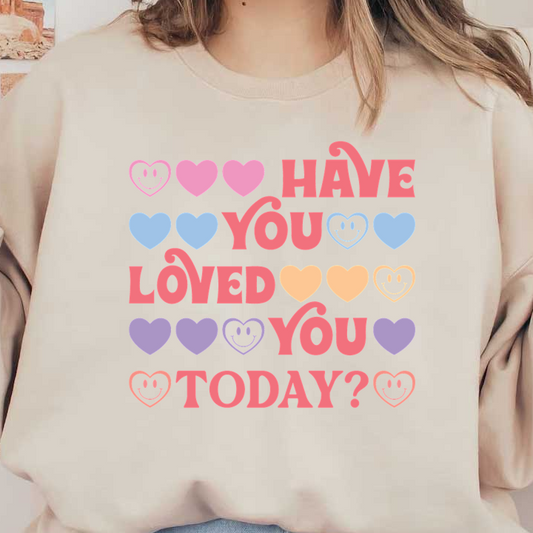 A vibrant design featuring playful text that reads, "Have you loved you today?" surrounded by colorful hearts.dtf regular iron