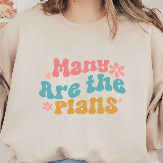 A colorful graphic design featuring the playful phrase "Many Are the *Plans" in bold, whimsical lettering with flowers and stars.dtf regular iron