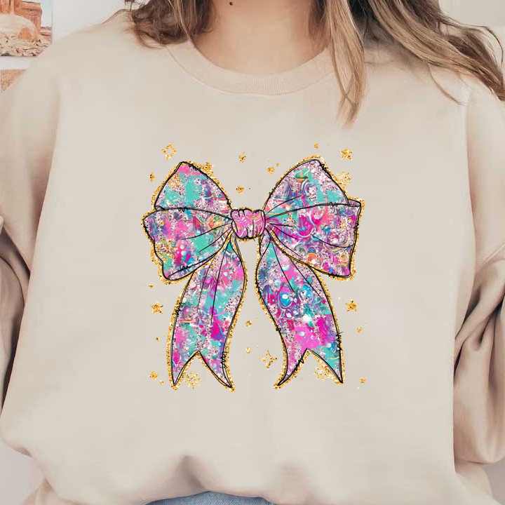 A vibrant and playful graphic bow with a colorful, abstract design and a sparkling gold outline, perfect for adding a fun touch.DTF Transfers dtf prints