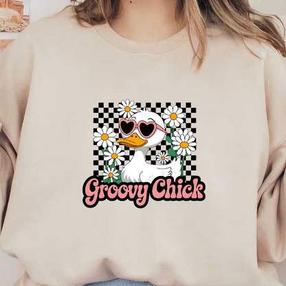 A cheerful cartoon duck wearing heart-shaped sunglasses surrounded by daisies, featuring the playful text "Groovy Chick."DTF Transfers