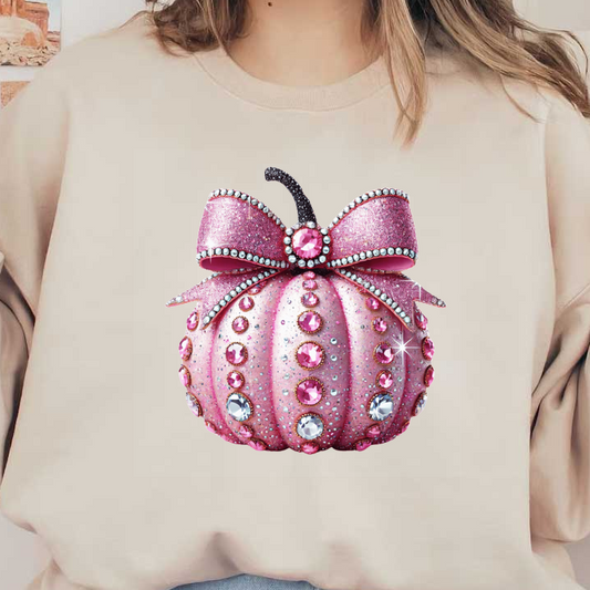 Esta calabaza rosa brillante presenta un lazo resplandeciente y está adornada con gemas de colores, perfecta para la decoración festiva.