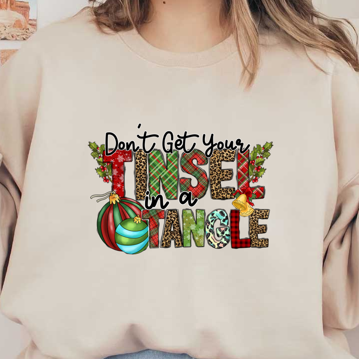 A festive and playful graphic featuring the phrase "Don't Get Your Tinsel in a Tangle," adorned with Christmas ornaments and holly.DTF Transfers heat press transfers heat press transfers