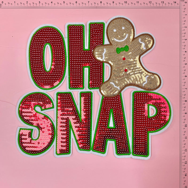 Fun and sparkly "Oh Snap" patch featuring vibrant red and green letters with a charming gingerbread man accent. Perfect for festive crafts!Patches