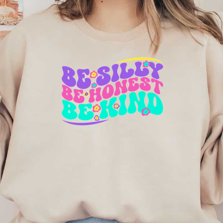 A vibrant and colorful graphic featuring the uplifting phrase "Be Silly, Be Honest, Be Kind," decorated with playful flowers.dtf regular iron