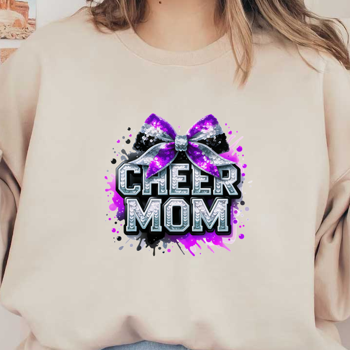 Bright and playful "Cheer Mom" graphic featuring a sparkly black and purple bow, perfect for celebrating cheerleading enthusiasts!DTF Transfers dtf transfers