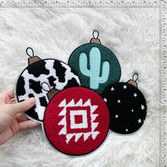 A colorful set of festive ornaments featuring unique designs like a cactus, cow print, and geometric patterns, perfect for holiday decor.Patches