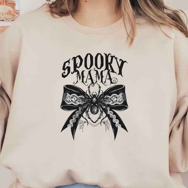 This spooky design features a decorative bow with a detailed spider and the words "Spooky Mama" in bold lettering.