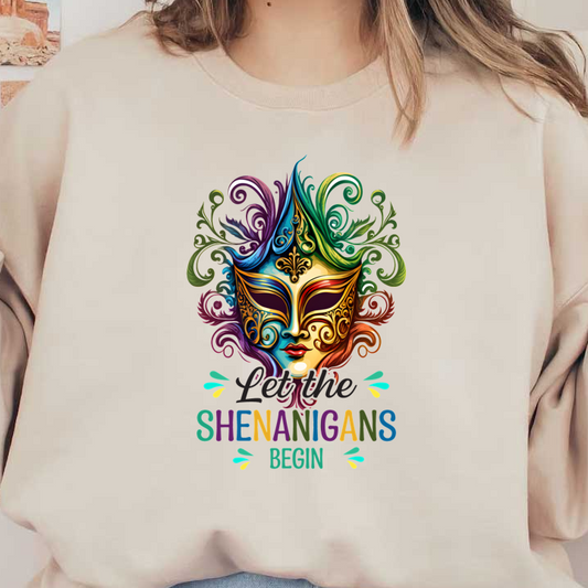 A vibrant, colorful mask design featuring intricate patterns, surrounded by playful swirls, with the phrase "Let the Shenanigans Begin!"DTF Transfers