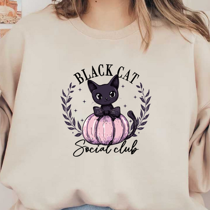 A cute black cat with big eyes sits on a pastel pink pumpkin, adorned with a bow and surrounded by laurel leaves.dtf regular iron